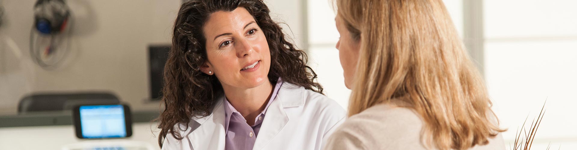 Audiologist explaining testing results