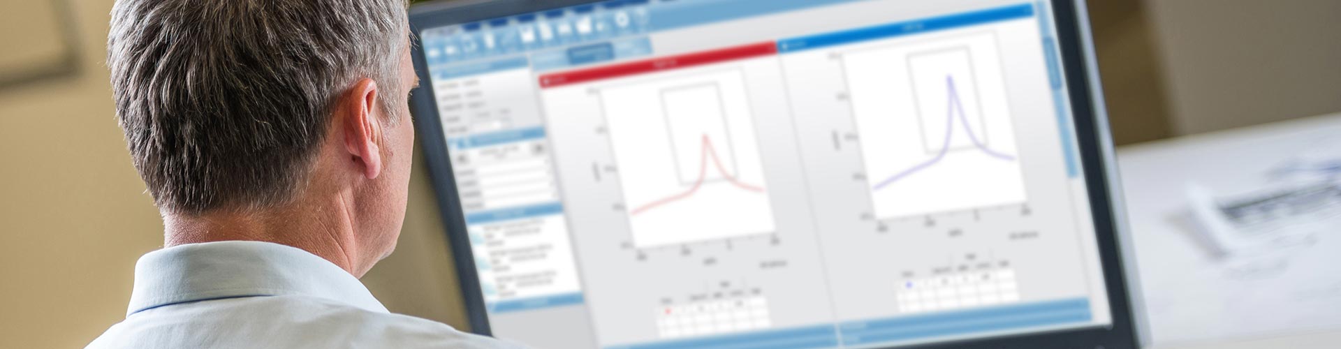 A clinician reviewing tympanometry testing results
