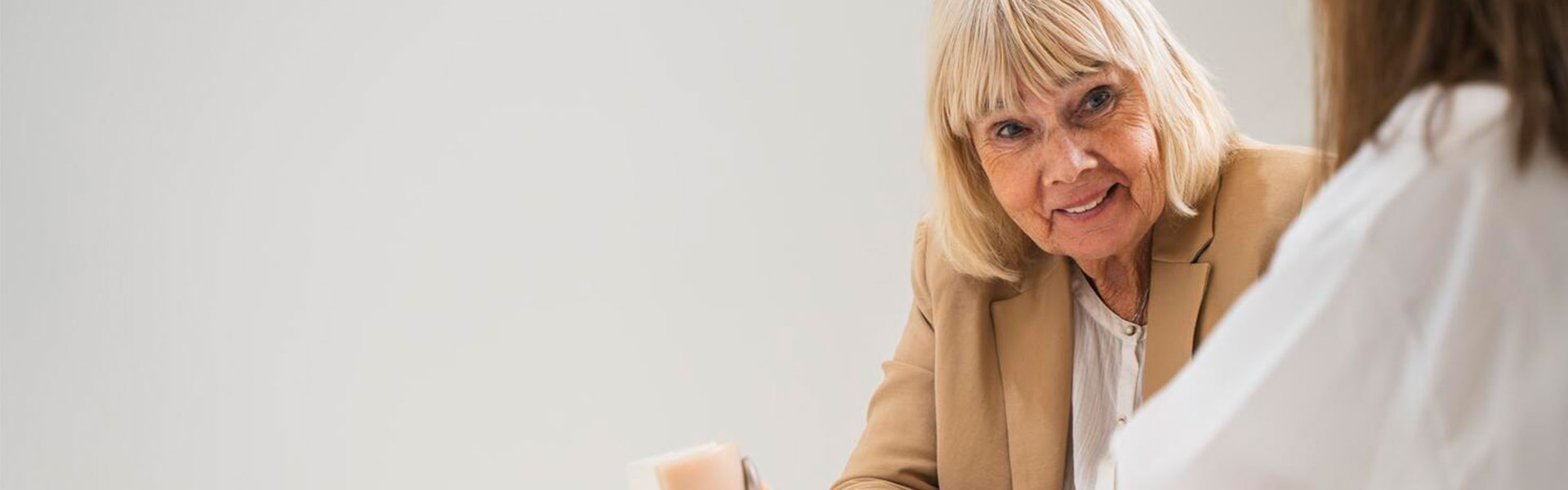 om_bahs_audiologist-and-senior-female-client_02_web