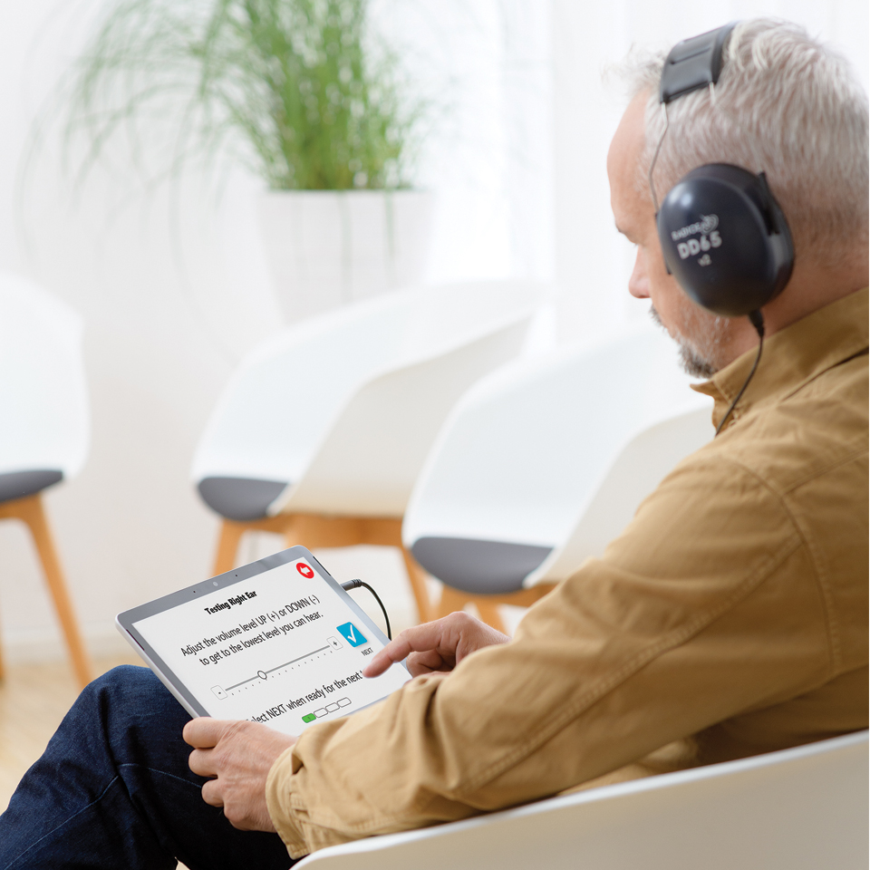 man-taking-hearing-test